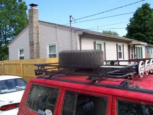 installation of a spare tire on the roof rack